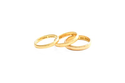 Lot 420 - Three 22 Carat Gold Band Rings, finger sizes J,...