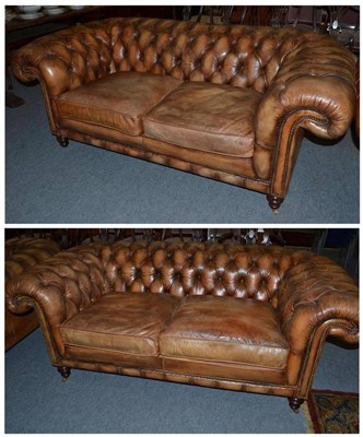 Lot 475 - Two large leather Chesterfield sofas