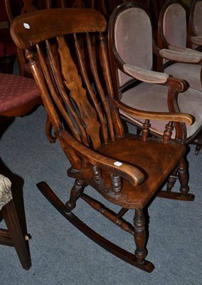 Lot 477 - A Victorian ash and elm high back Windsor rocking chair