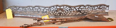 Lot 1254 - A George III Pierced Steel Fender, decorated...