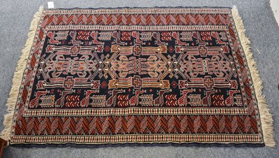 Lot 1221 - Baluch Prayer Rug, the charcoal field with...