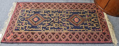 Lot 1223 - Baluch Rug, the indigo field with two serrated...