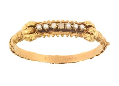 Lot 2118 - A Cultured Pearl Hinged Bangle seven cultured...