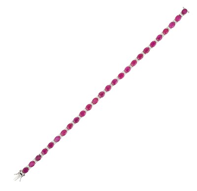 Lot 2049 - A Ruby and Diamond Bracelet the twenty-six...