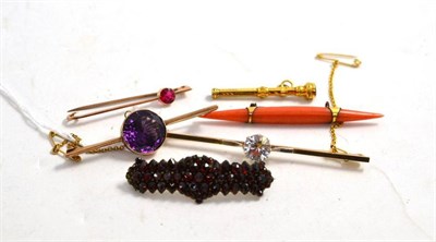 Lot 78 - A coral brooch, three stone set bar brooches, a garnet brooch and a Victorian pencil