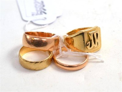 Lot 94 - Three 9ct gold band rings and a 9ct gold signet ring