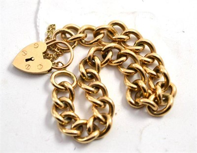 Lot 95 - A 9ct gold curb and lock bracelet