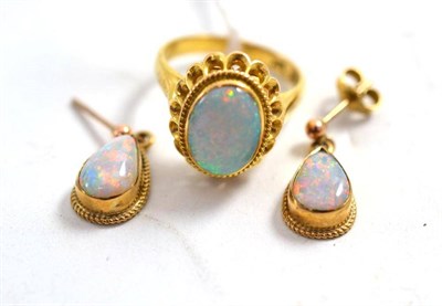 Lot 101 - An opal ring stamped '14k' and a pair of opal set earrings