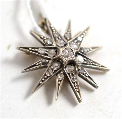 Lot 106 - A diamond star brooch