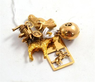 Lot 111 - A 9ct gold Adam & Eve Apple charm, a 9ct gold ram charm and three others