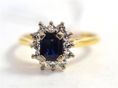 Lot 113 - An 18ct gold sapphire and diamond cluster ring