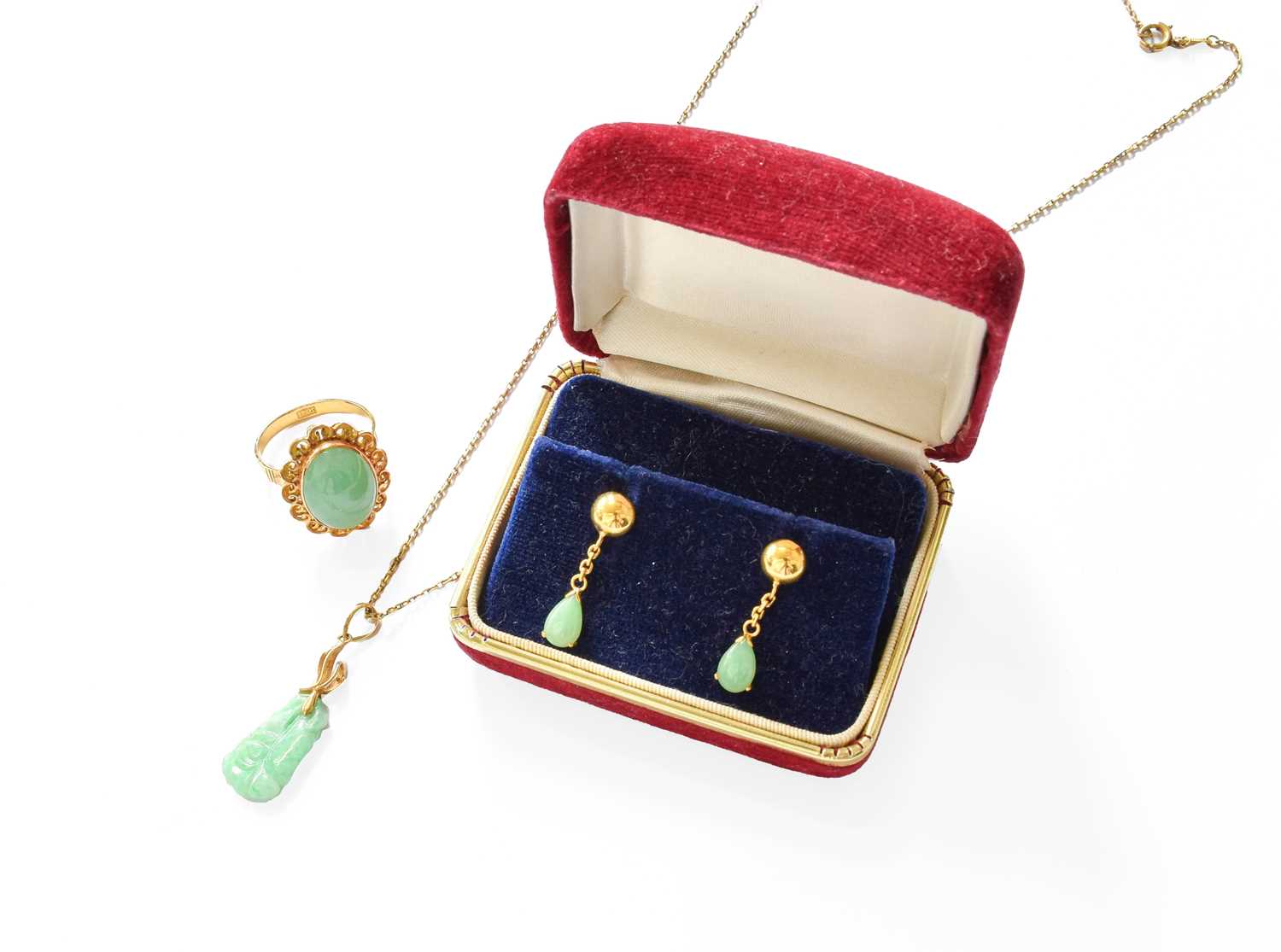 Lot 403 - A Jade Ring, the oval cabochon jade in a...