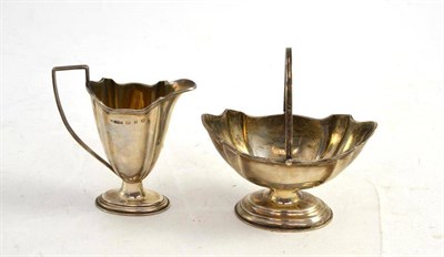 Lot 126 - A silver cream jug and sugar basket