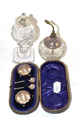 Lot 134 - A pair of silver salts and spoons in a fitted case, silver mounted cut glass scent bottle and a cut