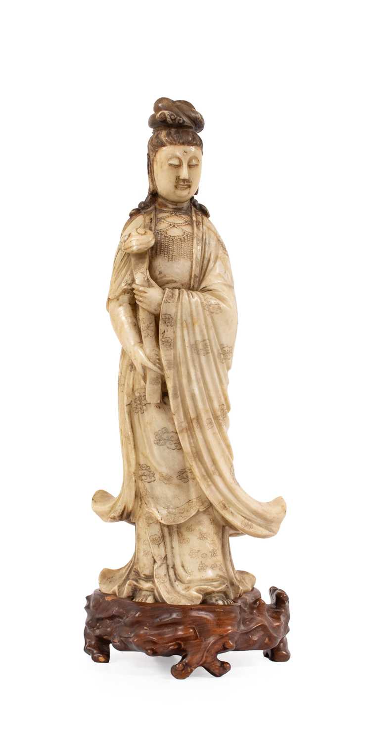Lot 70 - A Chinese Soapstone Figure of Guanyin, Qing...