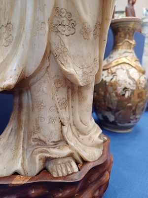 Lot 70 - A Chinese Soapstone Figure of Guanyin, Qing...