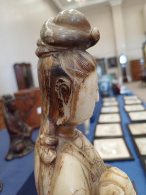 Lot 70 - A Chinese Soapstone Figure of Guanyin, Qing...