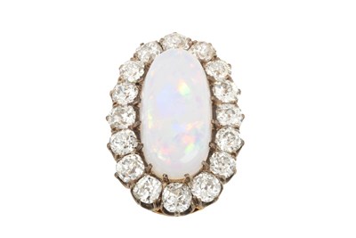 Lot 2083 - An Opal and Diamond Cluster Ring the oval...