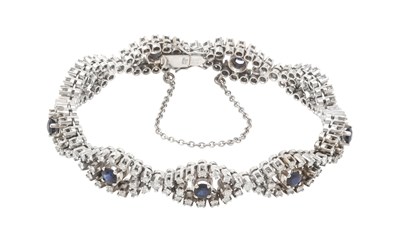 Lot 2071 - An 18 Carat White Gold Sapphire and Diamond...