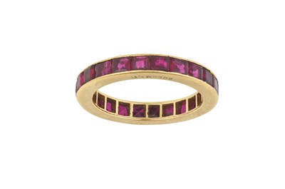 Lot 2296 - An 18 Carat Gold Ruby Eternity Ring, by...