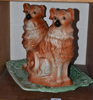 Lot 159 - Two Staffordshire dogs and a majolica dish