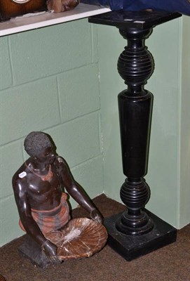 Lot 166 - Blackamoor plaster bust holding a shell shaped dish and ebonised torchere