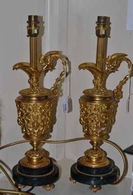 Lot 168 - Pair of decorative gilt ewer table lamps