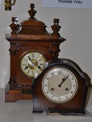 Lot 170 - Walnut cased mantel clock with inscription and an oak mantel clock (2)