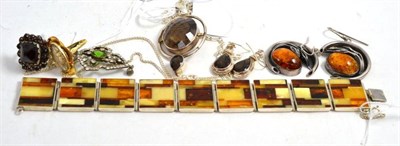 Lot 173 - Amber bracelet, earrings, garnet ring, paste pendant and a smokey quartz pendant and earrings