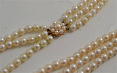 Lot 188 - A three strand necklace of cultured pearls