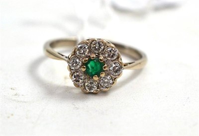 Lot 189 - An emerald and diamond cluster ring, stamped '18CT'