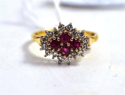 Lot 191 - An 18ct ruby and diamond cluster ring