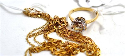 Lot 193 - A 9ct gold cubic zirconia ring and two fine chains