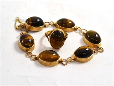 Lot 198 - A yellow metal tigers eye bracelet and a tigers eye ring to match