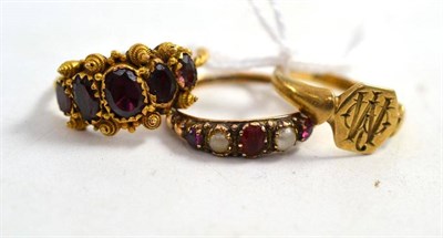 Lot 202 - A garnet five stone ring, a garnet and split pearl ring, a 9ct gold signet ring