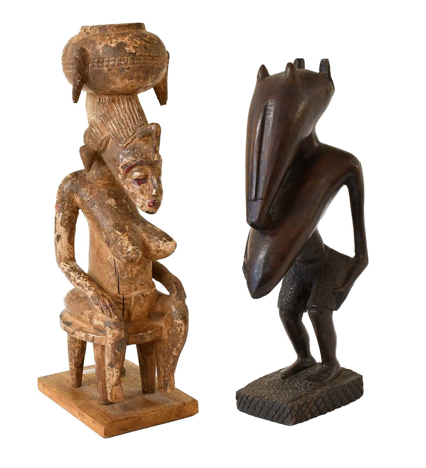 Lot 394 - A Senufo Carved Wood Figure of a Woman, Ivory...