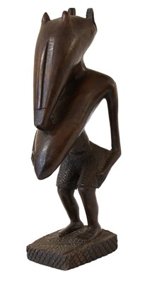Lot 394 - A Senufo Carved Wood Figure of a Woman, Ivory...