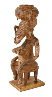 Lot 394 - A Senufo Carved Wood Figure of a Woman, Ivory...
