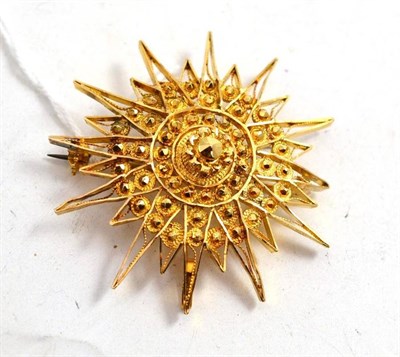 Lot 218 - A filigree starburst brooch/pendant