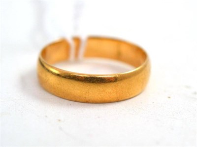 Lot 220 - An 18ct gold bang ring