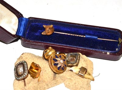 Lot 227 - A fox stick pin, a pearl and enamel stick pin, a mourning pin and five others