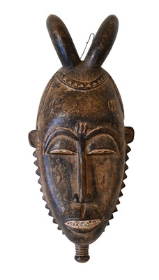 Lot 402 - An Igbo Carved Wood Face Mask, Nigeria, the...