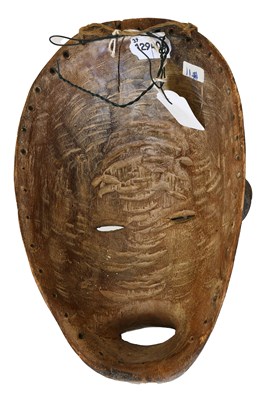 Lot 402 - An Igbo Carved Wood Face Mask, Nigeria, the...