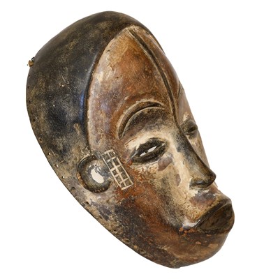 Lot 402 - An Igbo Carved Wood Face Mask, Nigeria, the...