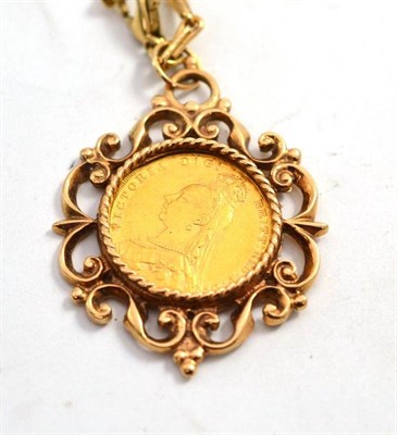 Lot 236 - An 1890 sovereign in an ornate 9ct gold pendant mount, on a fancy link chain