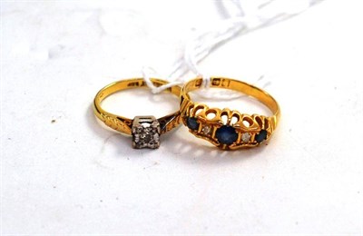 Lot 237 - An 18ct gold sapphire and diamond ring and a diamond solitaire ring