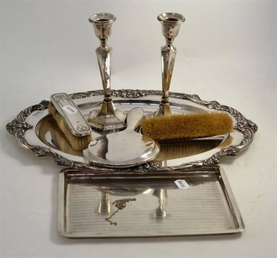 Lot 262 - A silver dressing table tray, two candlesticks (a.f.), two brushes and a hand mirror, also an...