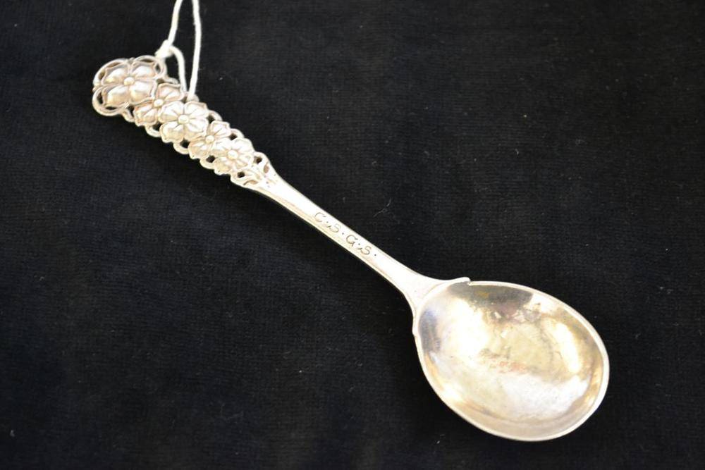 Lot 947 - An Arts & Crafts Silver Spoon, by Omar Ramsden & Alwyn Carr, London 1910, with shaped hammered...