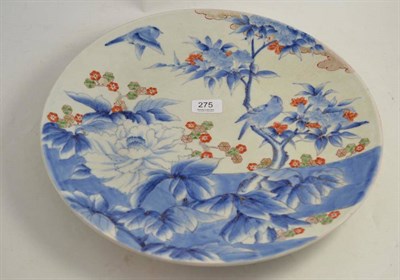 Lot 275 - A Japanese Arita porcelain dish decorated with bird and flowering plants