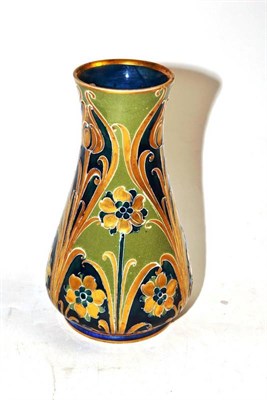 Lot 287 - A William Moorcroft Mackintyre vase, green painted monogram and DES (chipped)